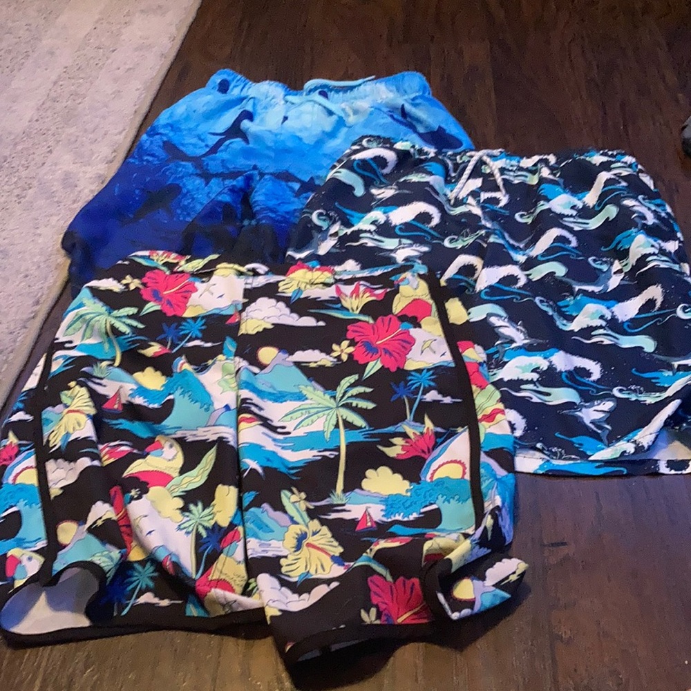 Three pairs of boys swim trunks